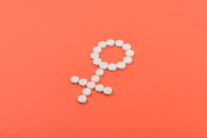 The female symbol made up of contraceptive pills